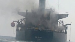 Smoke billows from a Panama-flagged oil tanker in the Strait of Hormuz in mid-September. Iran said the vessel hit sea mines, while the US military said it was hit by an Iranian missile.