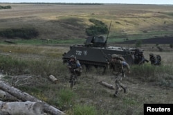 Ukrainian service members attend military exercises near Bakhmut