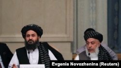 FILE: Taliban chief negotiators Mohammad Abbas Stanikzai (R) and Mullah Abdul Ghani Baradar during talks with senior Afghan politicians in Moscow in May.