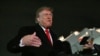 US President Donald Trump speaks with reporters upon his arrival to Joint Base Andrews, Maryland on October 10.