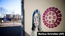 Mural u Berlinu, 14 mart 2020.