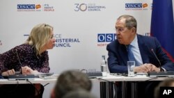 North Macedonia - Russia's Foreign Minister Sergey Lavrov shares a word with spokesperson Maria Zakharova at a news conference, during the OSCE Ministerial Council meeting in Skopje, December 1, 2023.