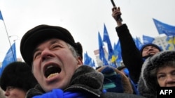 Yanukovych supporters celebrate at a rally in front of the Central Election Commision in Kyiv today.