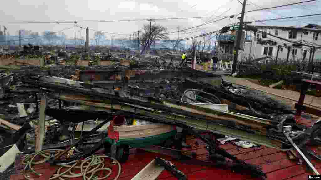 OCTOBER 30, 2012 -- Homes devastated by fire and the effects of Hurricane Sandy in the Breezy Point section of the Queens borough of New York City. (Reuters/Shannon Stapleton)