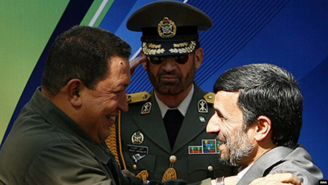 Deadly embrace? Venezuela's Hugo Chavez and Iran's Mahmud Ahmadinejad at a welcoming ceremony in Tehran in April 2009.