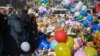 People visit a makeshift memorial to victims of a shopping mall fire in Kemerovo in western Siberia in March 2018. 