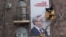 Armenia - Workers put up an election billboard of President Serzh Sarkisian in Yerevan, 21Jan2013.