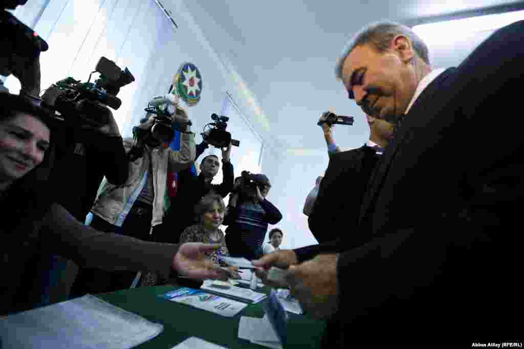 Presidential candidate Camil Hasanli casts his ballot at a polling station in Baku.