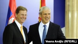 German Foreign Minister Guido Westerwelle (left) is welcomes by Serbian President Boris Tadic in Belgrade.