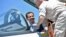 Syrian President Bashar al-Assad sits inside a Sukhoi Su-27 jet during his visit to the Russian air base at Hmeimim on June 27.