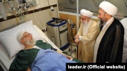 Ayatollah Ahmad Jannati (C) 91, and Judiciary chief Sadeq Larijani (R) visit Iranian supreme leader, Ayatollah Ali Khamenei after his prostate operation at a hospital in Tehran, 08Sep2014. File photo