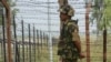 An Indian Border Security Force (BSF) soldier keeps guard at the Chakri post on the India-Pakistan border.