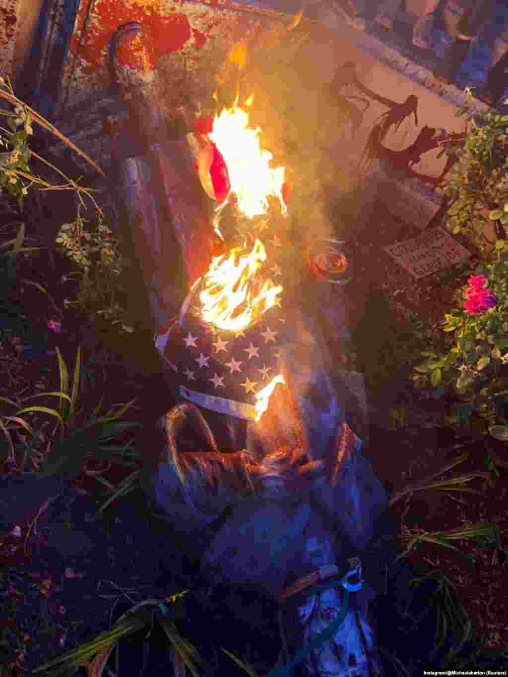 The statue of Christopher Columbus is seen on the ground after it was pulled down by protesters, following the death of George Floyd who died in police custody in Minneapolis, in Richmond, Virginia, U.S., June 9, 2020, in this picture obtained from social media. Columbus has been celebrated for centuries in the U.S. despite his history of colonization, enslavement and violence toward Native Americans.