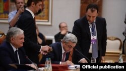 Belarus- Armenian President Serzh Sarkisian signs an accession treaty with the Eurasian Economic Union, Minsk, 10Oct2014.