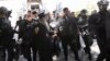 Служители на силите за сигурност ескортират патриарх Порфирий и митрополит Йоаникий към манастира в Цетине