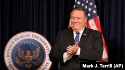 U. S. Secretary of State Mike Pompeo claps before being introduced at the Ronald Reagan Presidential Library Sunday, July 22, 2018, in Simi Valley, Calif.