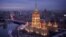 Russia -- Hotel Ukraina lit up at dusk. December 2013