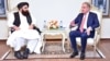 Taliban Foreign Minister Amir Khan Muttaqi (left) meets with his Pakistani counterpart, Shah Mahmood Qureshi, in Islamabad on December 18.