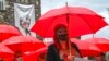 Macedonian sex workers carrying red umbrellas walk in front of the memorial house of Mother Teresa during a rally to mark the International Day to End Violence Against Sex Workers in Skopje, North Macedonia. Sex workers face a much greater risk of being exposed to sexual violence on the job.