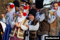 Romanian children take part in the traditional colindatul on Christmas Day.