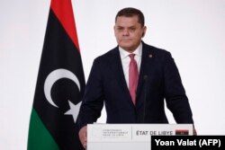 Абдул-Хамид Дбейба на очередной международной конференции по урегулированию в Ливии. Париж, 21 ноября 2021 года
