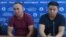 Qaster Musakhanuly (left) and Murager Alimuly speak to the press in Almaty on October 14.