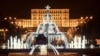 Christmas lights and decorations adorn the Alexandru Ioan Cuza fountain in front of Romania's Palace of the Parliament in downtown Bucharest. (file photo)