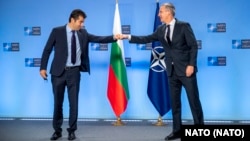 NATO Secretary-General Jens Stoltenberg (right) with Bulgarian Prime Minister Kiril Petkov (file photo)