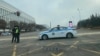 Kazakh police guard Almaty's Republic Square on December 16.