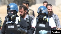 Инспекторы ООН на месте предполагаемого использования химического оружия в Сирии. 28 августа 2013 года.
