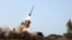 A handout picture provided by the Iranian Army media office on January 19, 2024, shows the launch of a missile during a military drill at an undisclosed location in southern Iran.