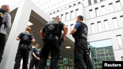 German police officers stand guard outside the hospital in Berlin where Aleksei Navalny is receiving medical treatment.