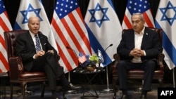 U.S. President Joe Biden (left) joins Israeli Prime Minister Benjamin Netanyahu
for a meeting of the Israeli war cabinet in Tel Aviv on October 18, 2023.