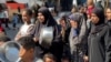 AFP - NUSEIRAT - GAZA - PALESTINIAN TERRITORIES - Gazans banging on their empty pots