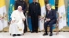 Pope Francis (left) speaks with Kazakh President Qasym-Zhomart Toqaev in Nur-Sultan on September 13. 