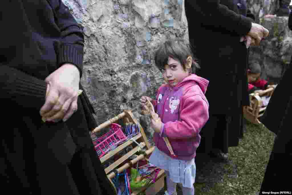 Many small children attend the ritual with the hopes that they, too, will end the day with a new cradle and doll.