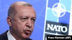 Turkish President Recep Tayyip Erdogan speaks during a media conference at a NATO summit in Brussels on June 14.