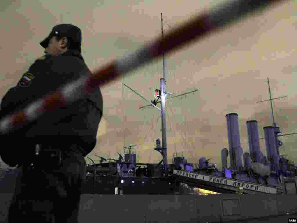 Activists from the Food Not Bombs movement climb a mast of the cruiser &quot;Aurora&quot; to protest against war and poverty in St. Petersburg, Russia. (Ruslan Shamukov for ITAR-TASS)