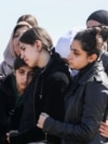 Mourners react during the funeral of Kurdish medical student Shinda Kisho, who was killed in Latakia, March 9