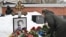 A woman lays flowers at the grave of Russian opposition leader Alexei Navalny at the Borisovo cemetery in Moscow on February 16, 2026, marking the second anniversary of his death in an Arctic colony.