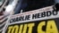 The front page of French satirical magazine Charlie Hebdo is seen at a newspapers kiosk in Paris on the opening day of the trial of the January 2015 Paris attacks against Charlie Hebdo satirical weekly