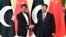 Chinese President Xi Jinping (right) shakes hands with Pakistani Prime Minister Imran Khan before a meeting in Beijing in April 2019.
