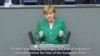 Angela Merkel vorbind în Bundestag după summitul UE dedicat migrației, 28 iunie 2018.