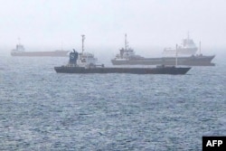 Vessels transiting through the Gulf of Oman are pictured off the coast of Muscat on July 25.