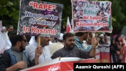 Pakistani Kashmiris hold placards during an anti-Indian protest at the diplomatic enclave in Islamabad on August 5.