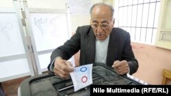 An Egyptian man takes part in the two days of referendum voting on the new constitutional draft in Cairo on January 14.