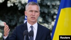 NATO Secretary-General Jens Stoltenberg speaks during a press conference with Ukrainian President Petro Poroshenko following a meeting of the NATO-Ukraine Commission in Kyiv on July 10.