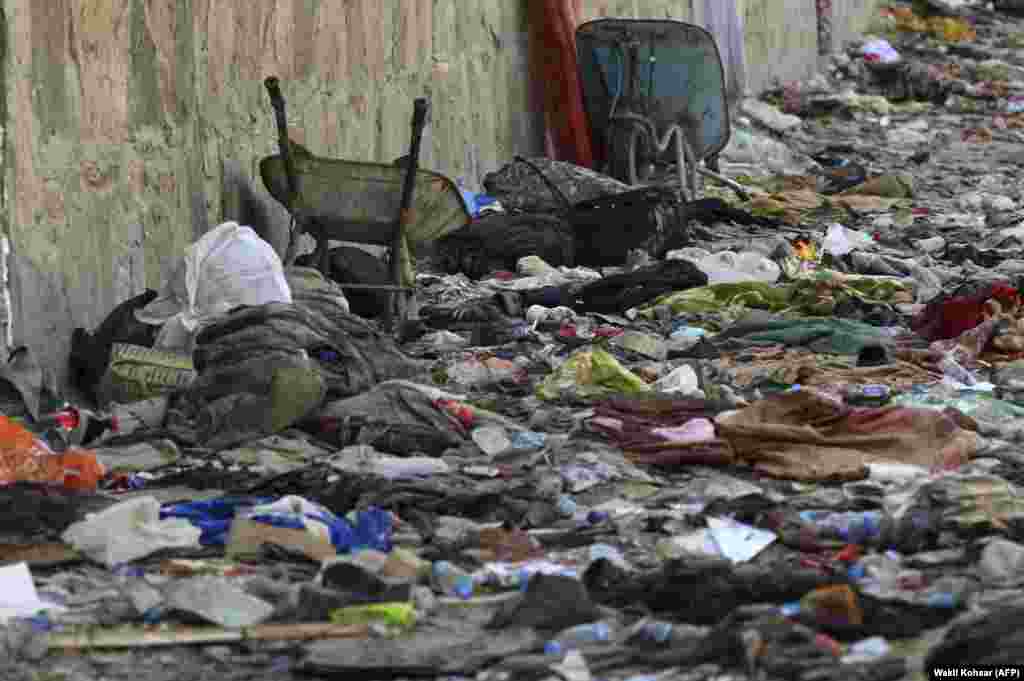 Backpacks and belongings of Afghans who were waiting to be evacuated are seen at the site of the August 26 suicide bombing outside the Kabul airport. More than 170 people were killed in the attack, including 13 U.S. soldiers.