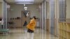 A boy plays with a paper plane in the corridor of a kindergarten in Koriyama.