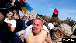 Lawmaker Nestor Shufrych was beaten by a mob in Odesa on September 30 while receiving little help from local police.